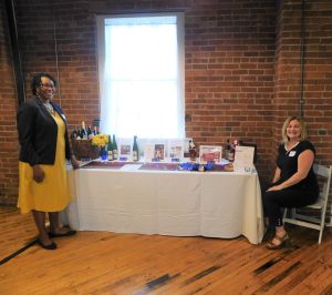 Tracye and Jenni at raffle table